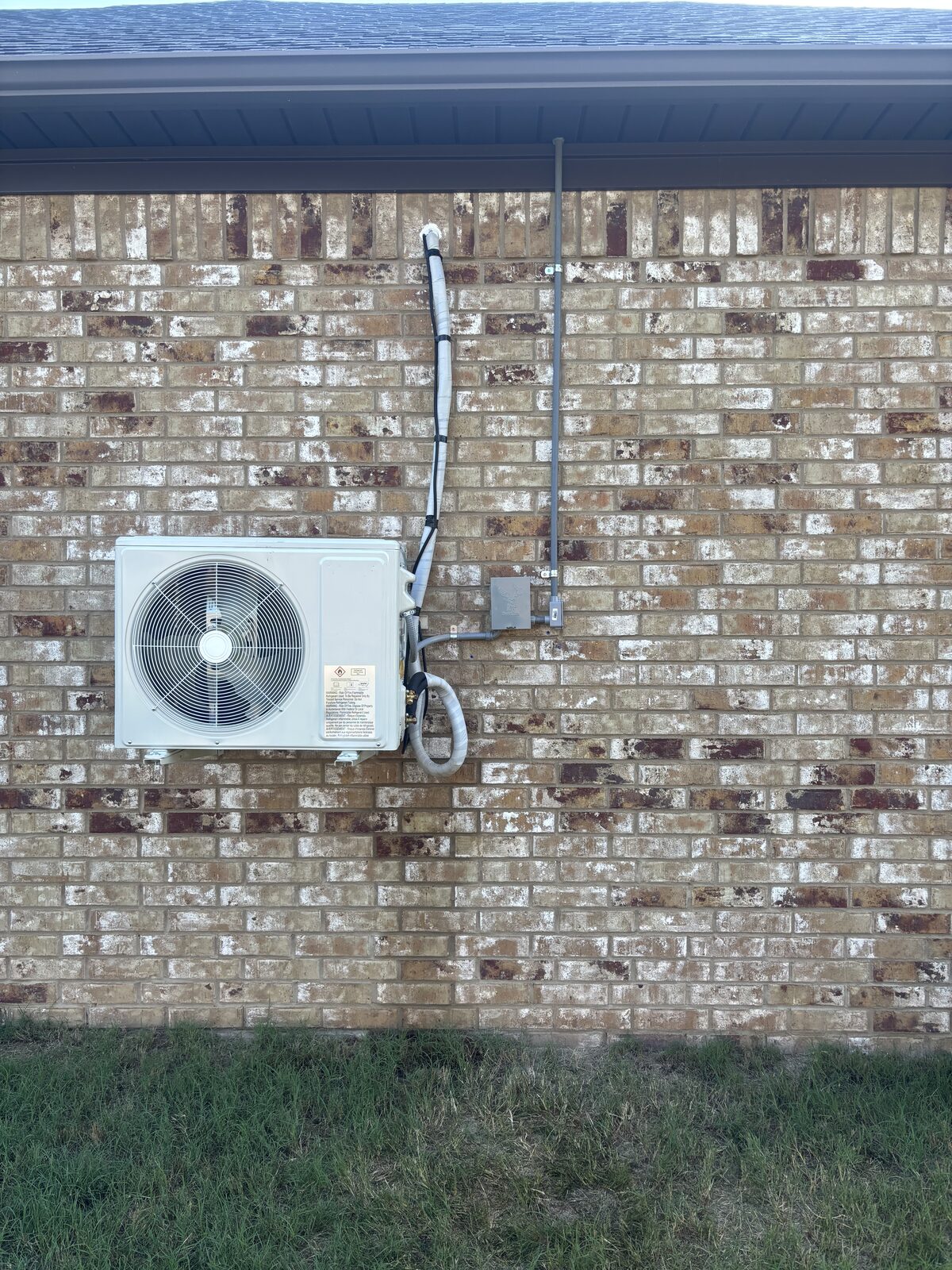 Outdoor mini-split condenser unit installed